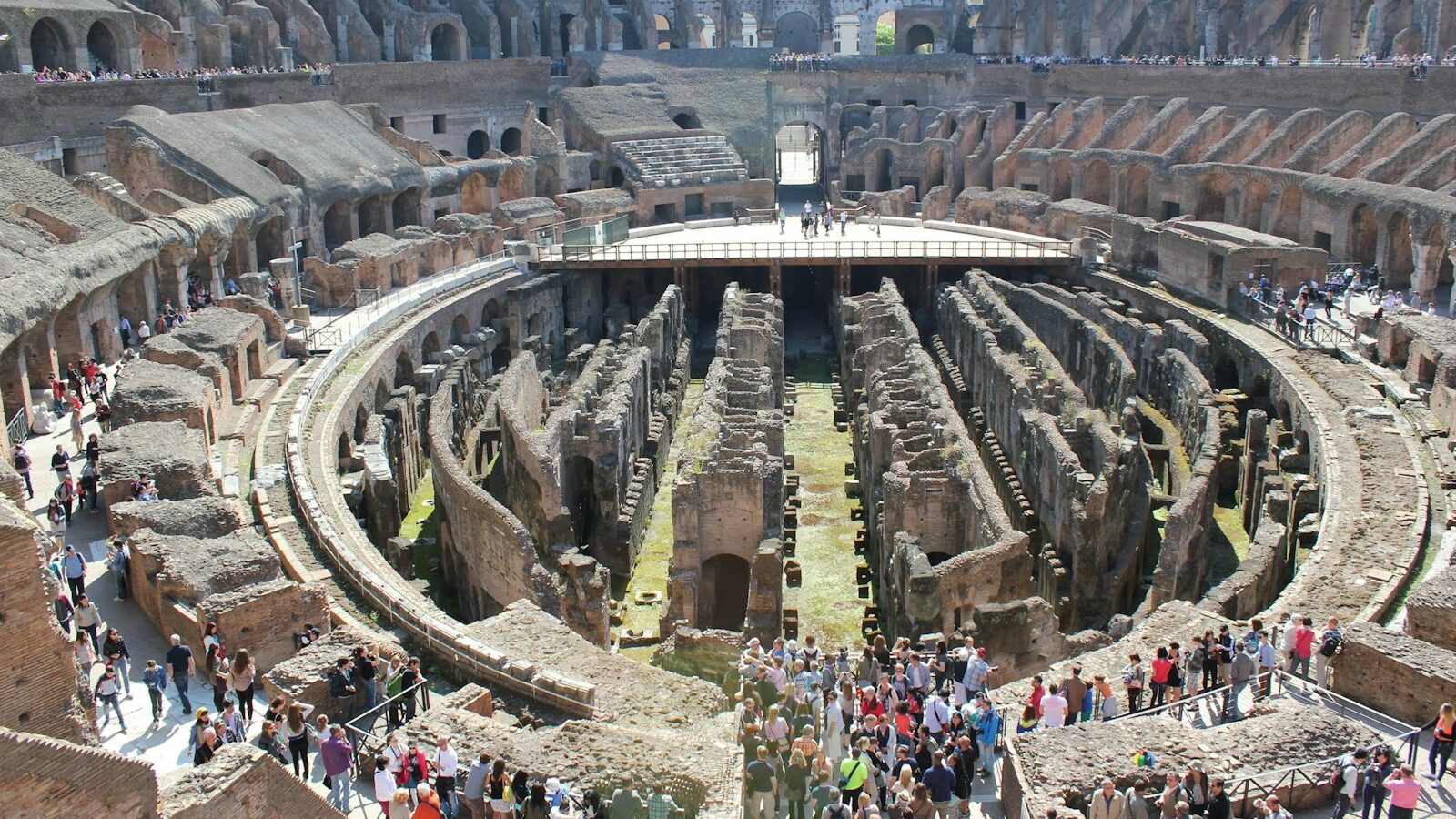 a group of people standing around a large building